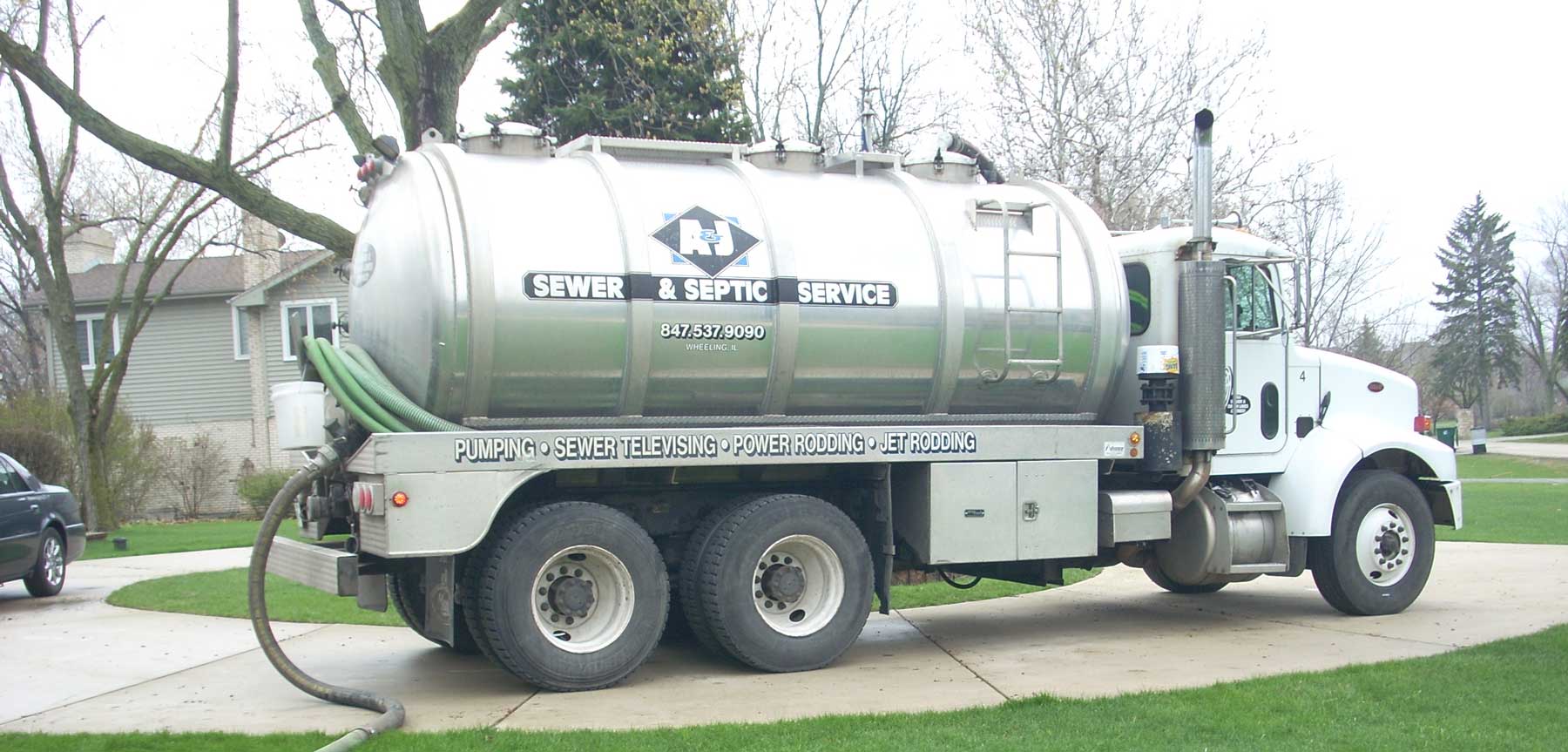 A&J tank truck at work on a residential job